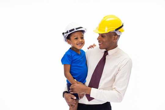 African American happy family of father and son wearing an engineering helmet together, like father like son or well education conccept