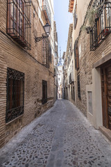 Naklejka na ściany i meble Narrow street in historic center of Toledo. Spain.