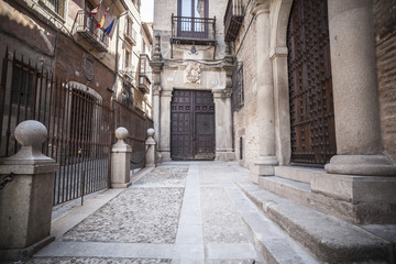Fototapeta na wymiar Old street and buildings in historical center of Toledo, Castilla- La Mancha, Spain.