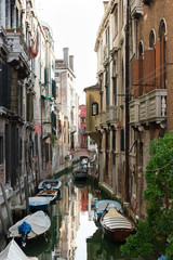 Mysterious Venice in summer time, one of the lovely side streets	