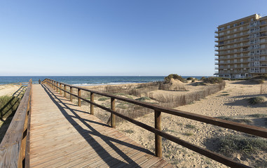Fototapeta premium Wooden walkway that gives access to one of the beaches of Arenales del Sol.