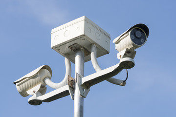 Outdoor CCTV Camera Operating for security in garden , on blue sky background
