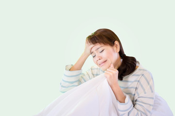 Asian Thai Woman Suffering From Depression Sitting On Bed And Crying. Isoleted white background image.