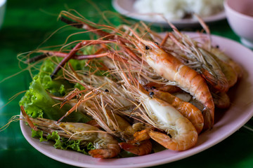 Grilled Shrimp and burn on green slad., sea food.