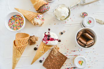 Ice Cream Cones And Fillers For Ice Cream On A White Concrete Background, Topping, Jam And Culinary Topping
