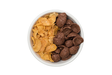 Top view of mix of corn flake and cocoa flavored cereal in white ceramic bowl isolated on white background with clipping path