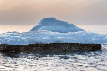 Fototapeta na wymiar Melting ice on Baltic sea coast.