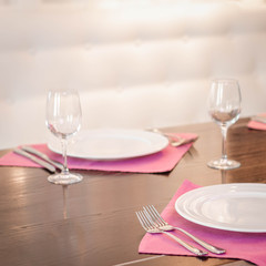 Served dinner table in a restaurant. Restaurant interior. Cozy restaurant table setting