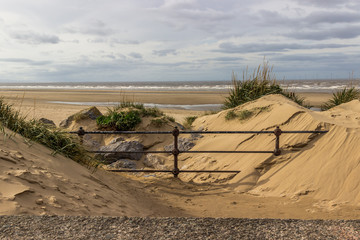 sand dunes and railings landscape