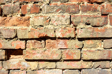 Red brick wall with cracks texture background