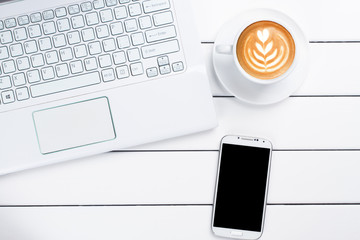 phone coffee laptop view from above wooden white background