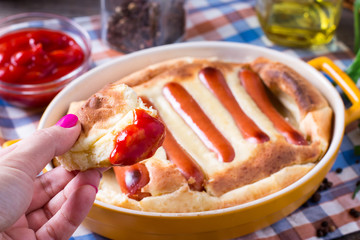 Toad in the hole - traditional sausage and pudding batter bake