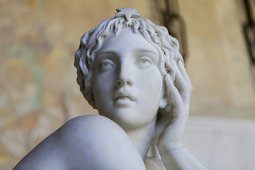 Marble sculpture of beautiful woman in a greek style