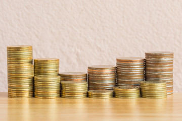 Gold coins and Bronze coins on wooden table