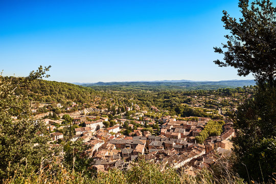 Sunny overview of the beautiful Provencal village Cotignac