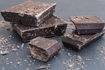 pieces of chocolate on black background