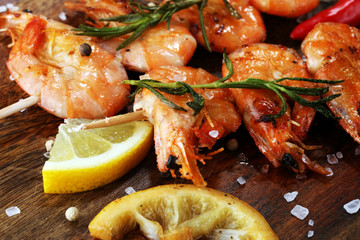 Grilled shrimp skewers. Seafood, shelfish. Shrimps Prawns skewers with herbs, garlic and lemon.