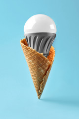 Led lamp in ice cream cone, innovation concept