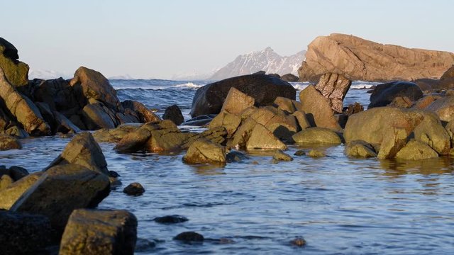 Waves hitting the rocks at Austvågsøya island at the Lofoten archipel in Northern Norway