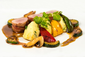 Steak chicken breast olive oil cherry tomatoes pepper and rosemary herbs.