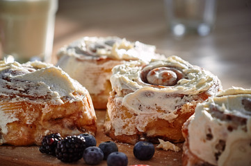 On the table are apetic baking and fresh berries