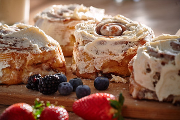 On the table are apetic baking and fresh berries