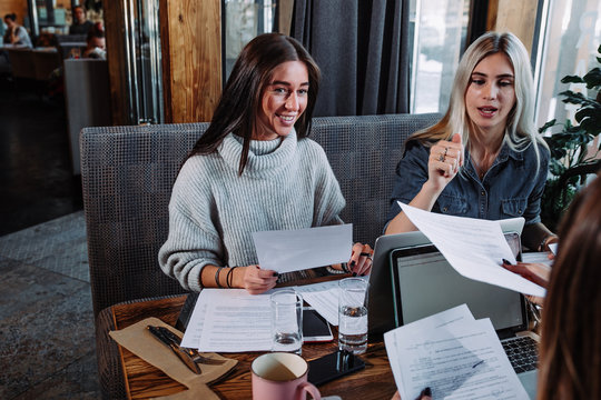 Two businesswoman working together about documents, partner discuss plan or idea and opinion meeting