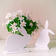 Easter bunnies with spring flowers