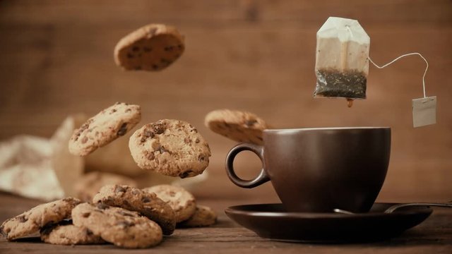 Cinemagraph - Dripping tea bag in a tea cup. Nobody. Motion Photo.