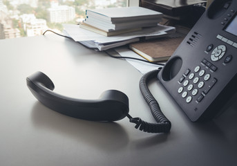 Telephone on desk in office.
