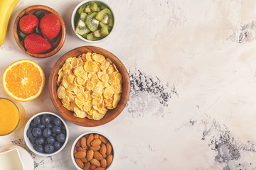 Healthy breakfast - bowl of corn flakes, berries and fruit