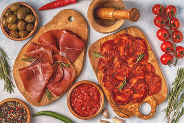 Spanish tapas with  chorizo,  jamon, picnic table.