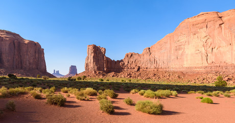 Scenic Drive on Dirt Road through Monument Valley, The famous Buttes of Navajo tribal Park, Utah -...