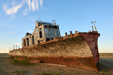 Fototapeta na wymiar Abandoned ships Aral Sea. The Aral Sea is a formerly un salt lake in Central Asia. The Aral Sea was an endorheic lake lying between Kazakhstan in the north and Uzbekistan in the south.