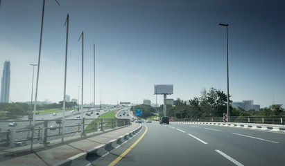 New asphalt road in a modern city. Cars on the highway