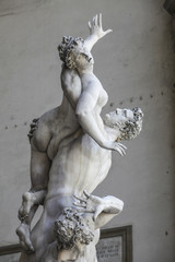 Marble sculpture of man and woman fight