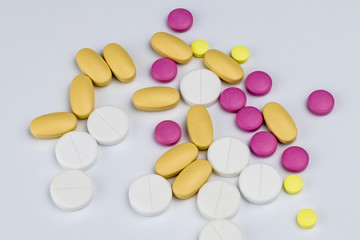 scattered medecine pills on white background