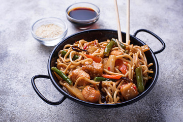 Stir fry noodles with chicken, tofu and vegetable.