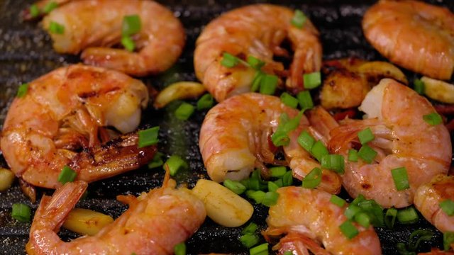 Fresh prawns with chilli and garlic on the grill