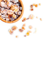 Types of sugar. Candy brown sugar in bowl on white background top view copy space