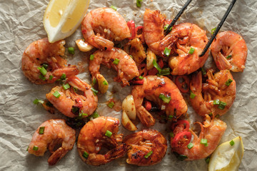 Large grilled BBQ shrimp with sweet chili sauce, green onion and lemon.