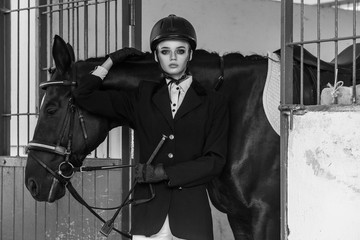 Equides club. Handsome young model posing near hourse.