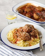 Delicious homemade meat balls in tomato sauce with spaghetti.