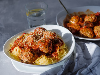 Delicious homemade meat balls in tomato sauce with spaghetti.