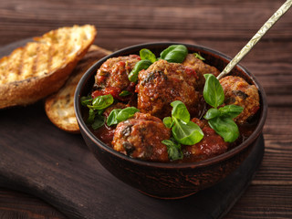Delicious homemade meat balls in tomato sauce.