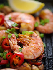Large grilled BBQ shrimp with sweet chili sauce, green onion and lemon.