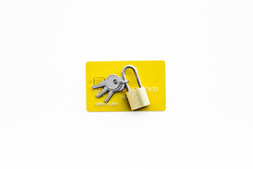 Electronic payments protection. Bank cards near lock and keys on white background top view copy space
