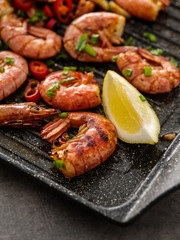 Large grilled BBQ shrimp with sweet chili sauce, green onion and lemon.