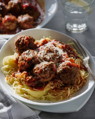 Delicious homemade meat balls in tomato sauce with spaghetti.
