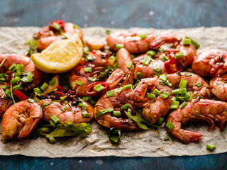 Large grilled BBQ shrimp with sweet chili sauce, green onion and lemon.